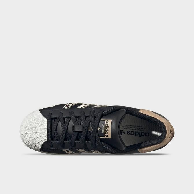 Women's black outlet and gold superstars