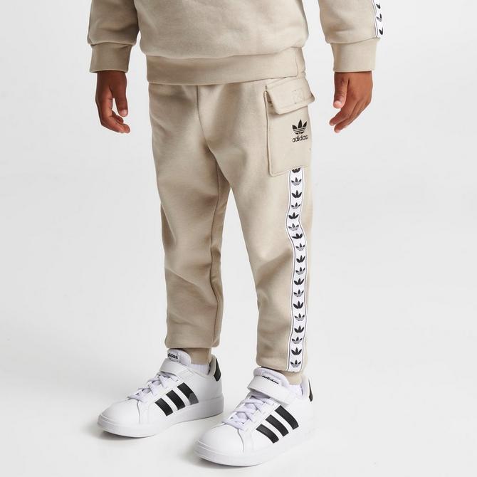 Adidas taped best sale poly track pants