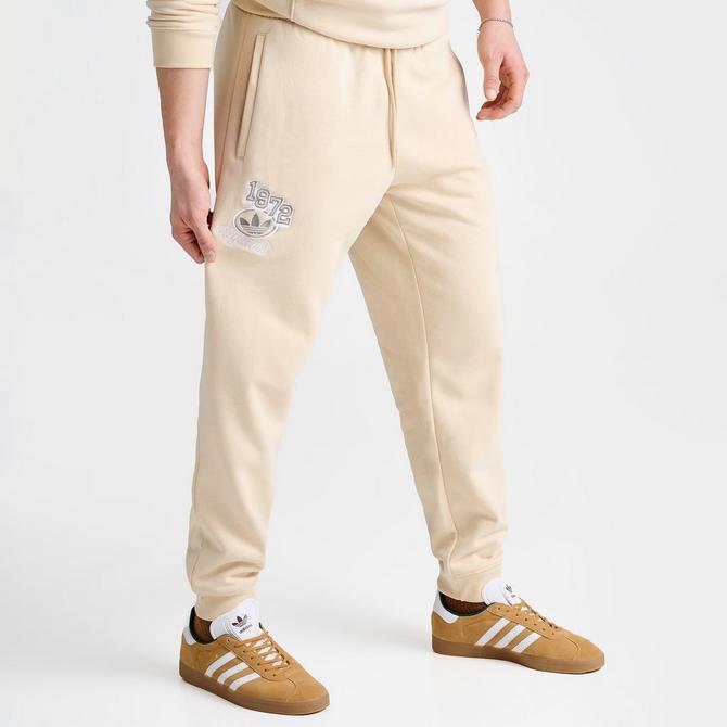 New Balance Collegiate Joggers In Off White And Green