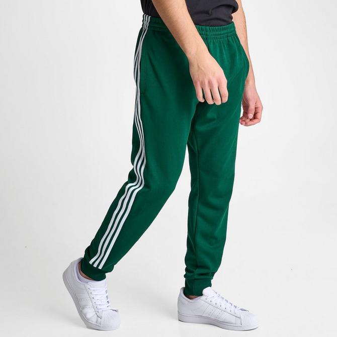 Dark green adidas track pants hot sale