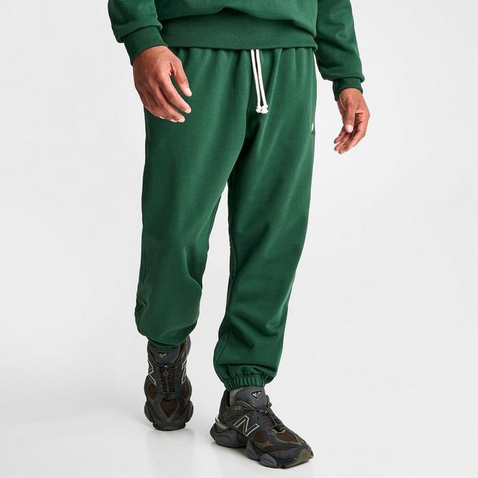 Shop New Balance 90s Athletic Sweatpants MP31503-NWG green