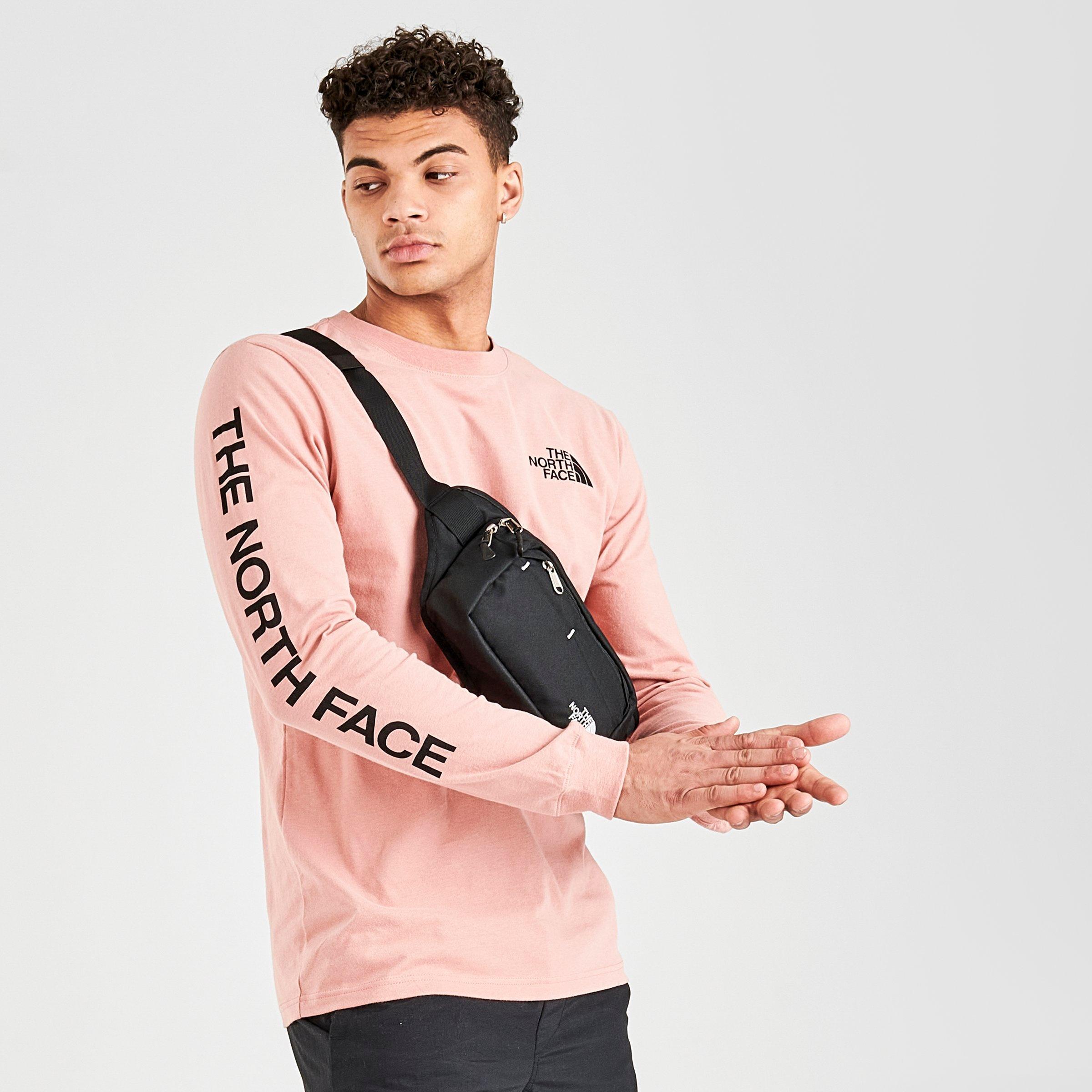 pink north face shirt