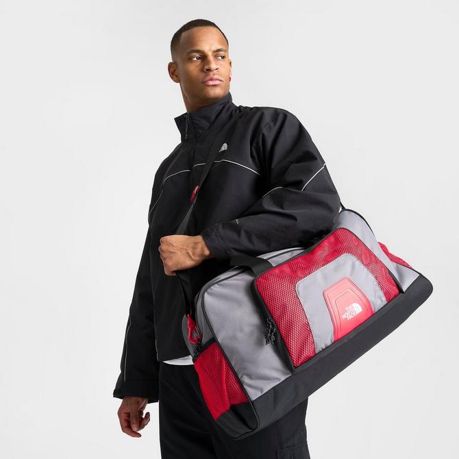 Red north face duffel bag deals