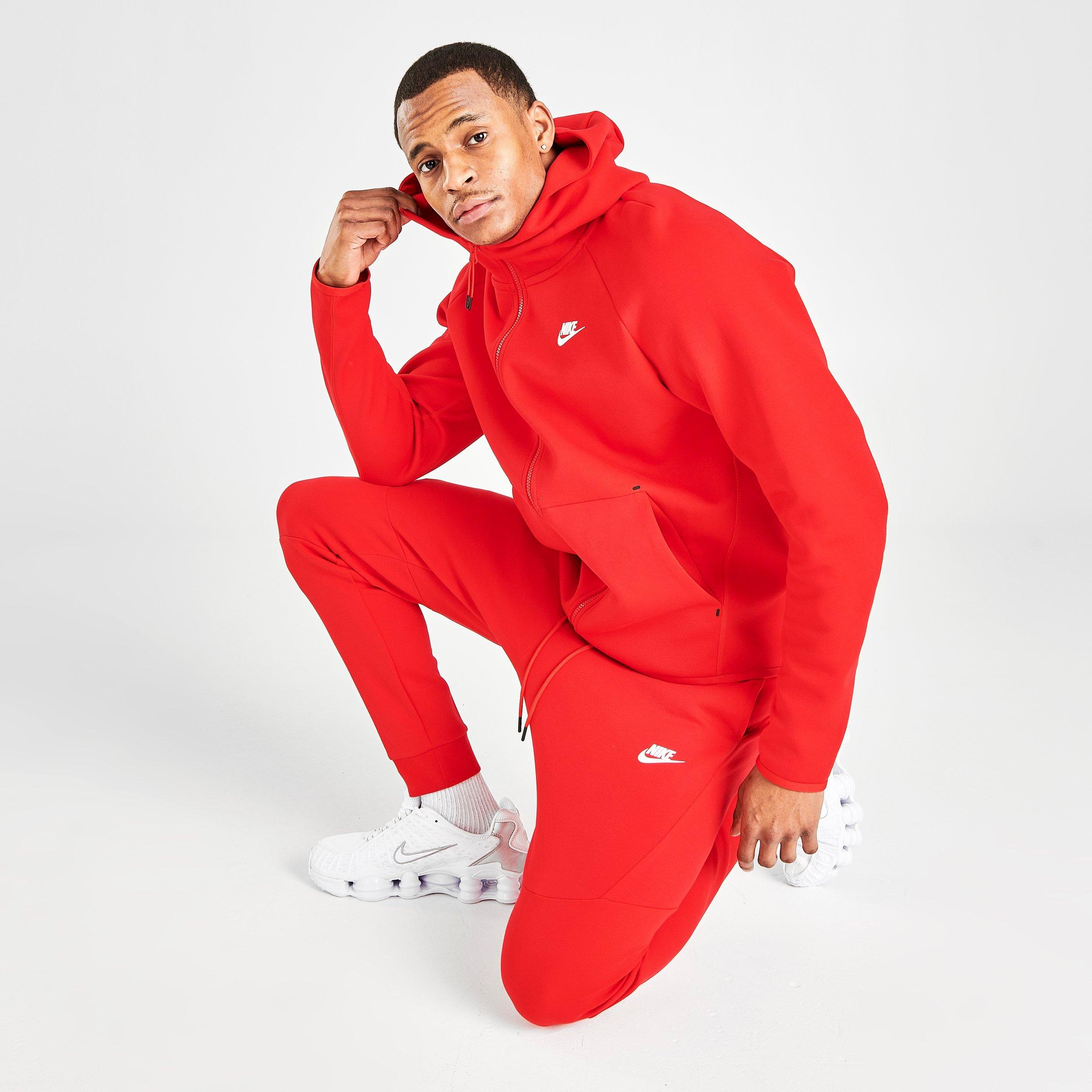 red and white nike jogging suit