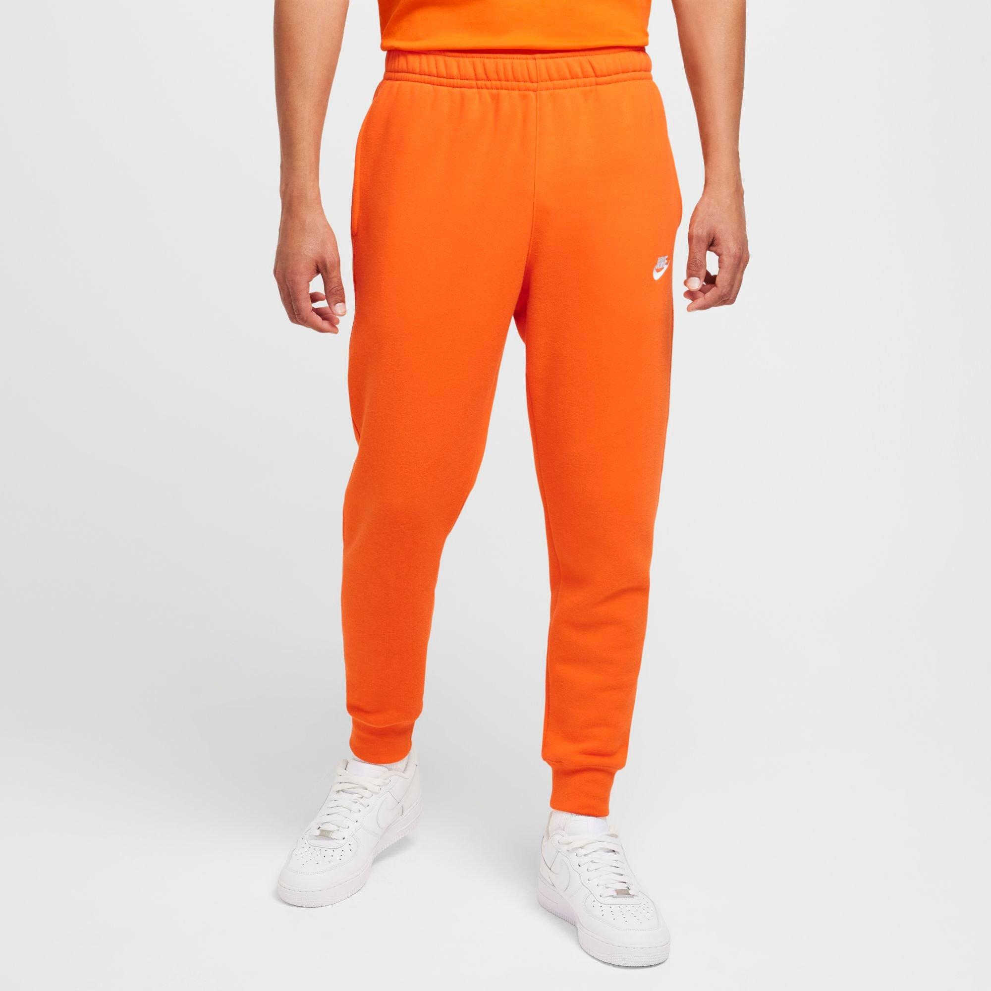 Nike Sportswear Club Fleece Jogger Pants in Safety Orange/Safety Orange/White Size: Large