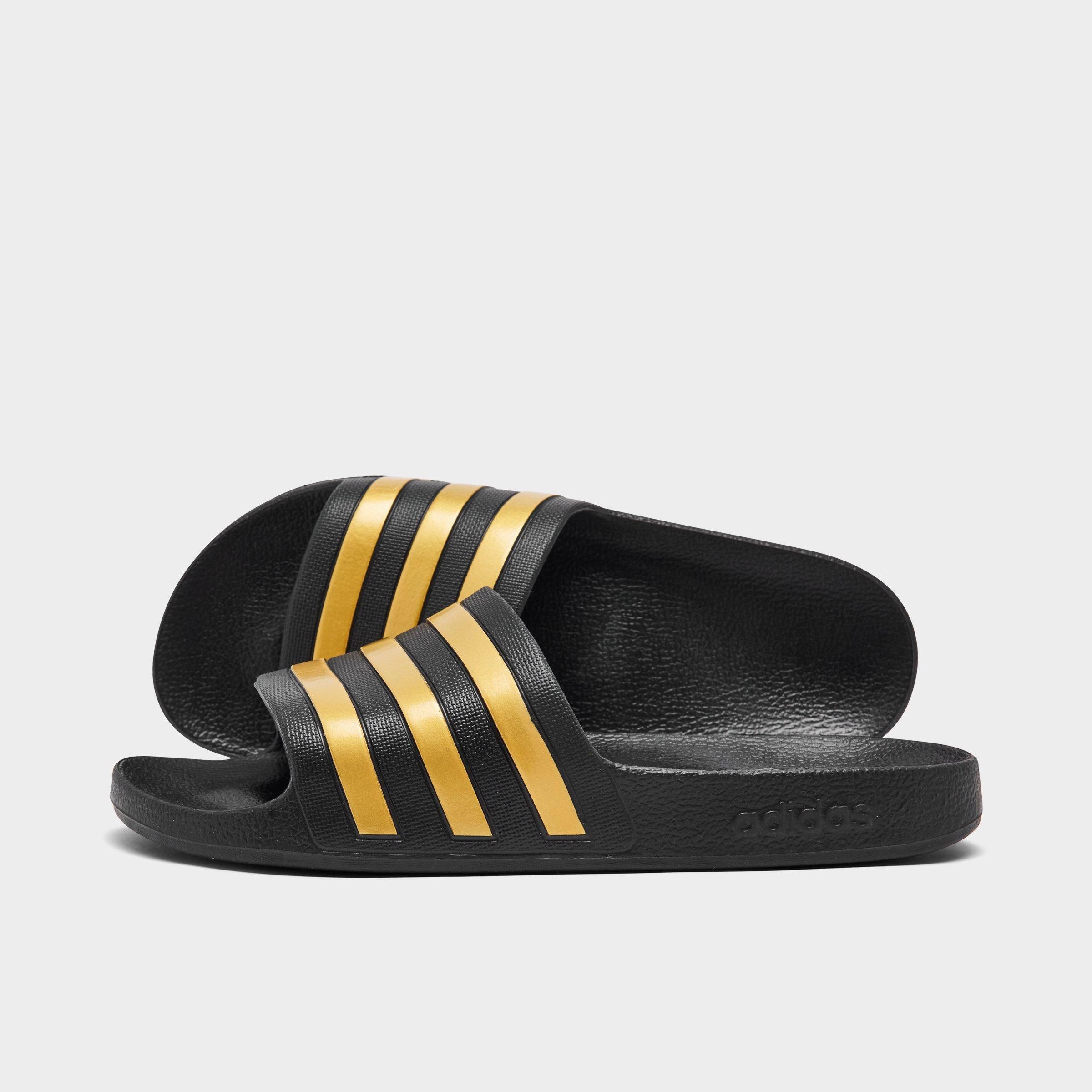 adidas Women's Originals adilette Aqua Slide Sandals in BLACK/GOLD METALLIC/ Size: 5.0