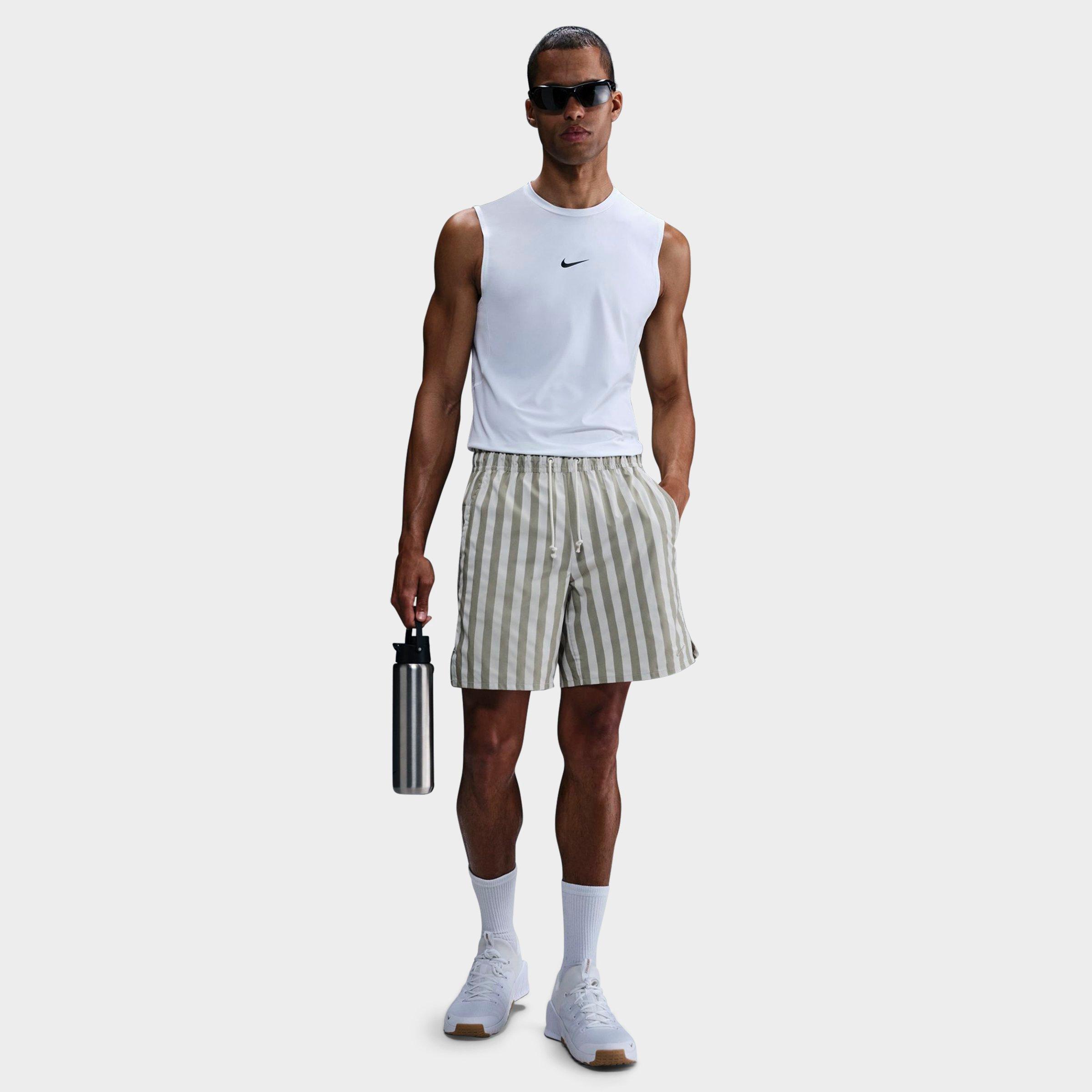 Nike Men's Unlimited Dri-FIT Striped 7" Unlined Versatile Shorts in LIGHT ARMY/LTBONE/LI Size: Small