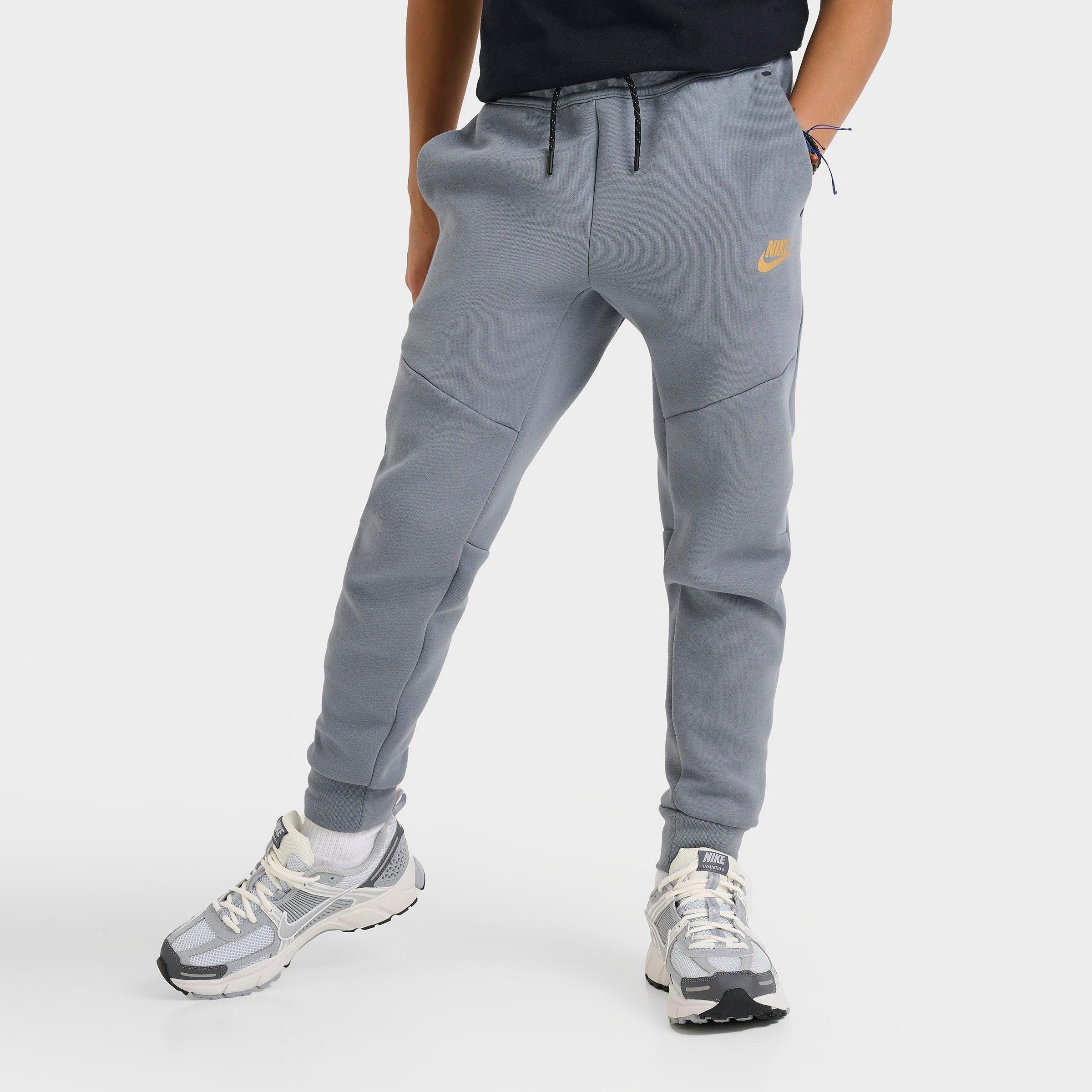 Nike Kids Sportswear Tech Fleece Reflective Jogger Pants in Cool Grey/Black/Metallic Gold Size: Small