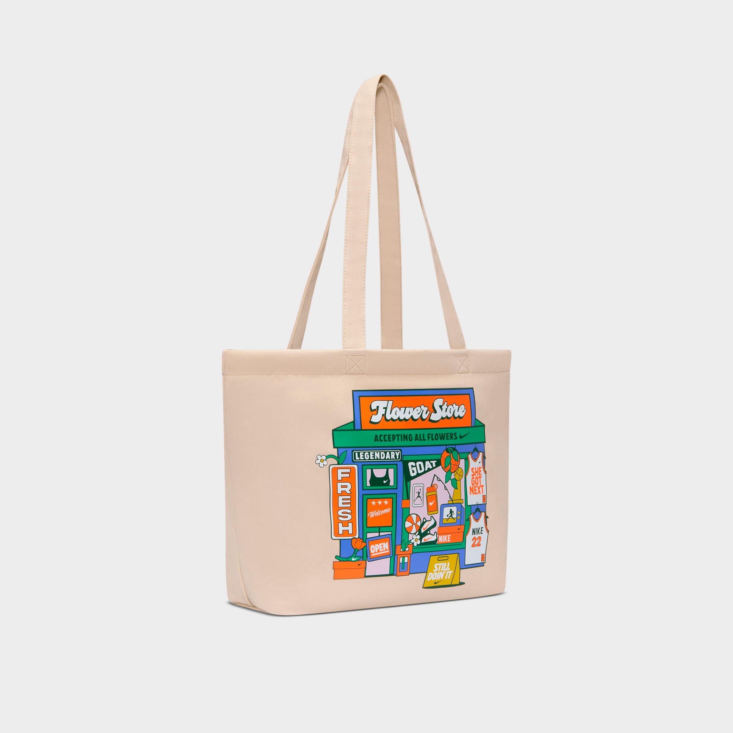 Nike Heritage Graphic Tote Bag (22L) in Oatmeal/Safety Orange/White