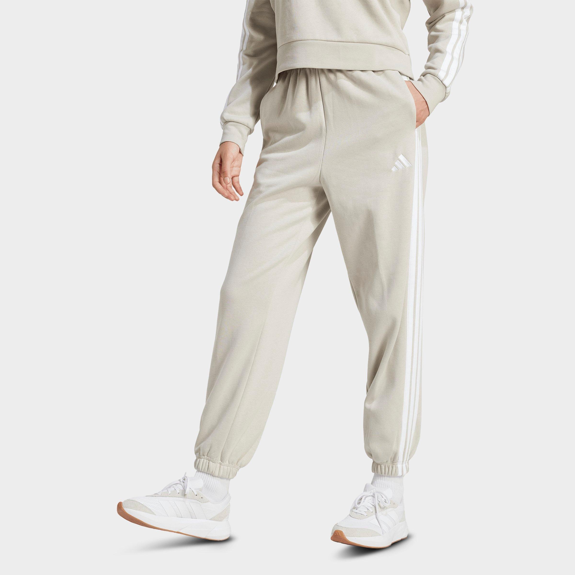 adidas Women's Essentials 3-Stripes Fleece Loose Pants in Beige/White Size: Large