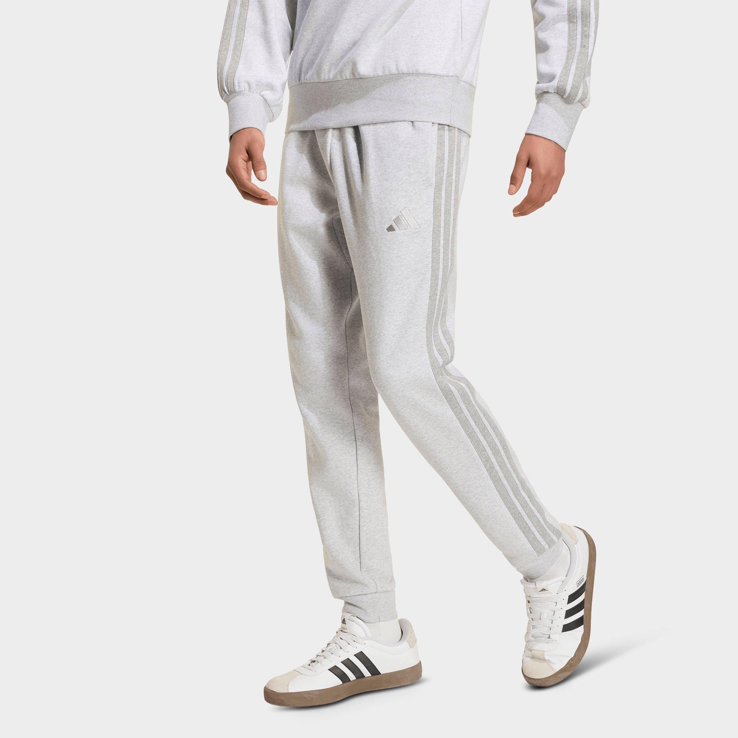 adidas Men's Essentials 3-Stripes Fleece Jogger Pants in Light Grey Heather/Medium Grey Heather Size: Small