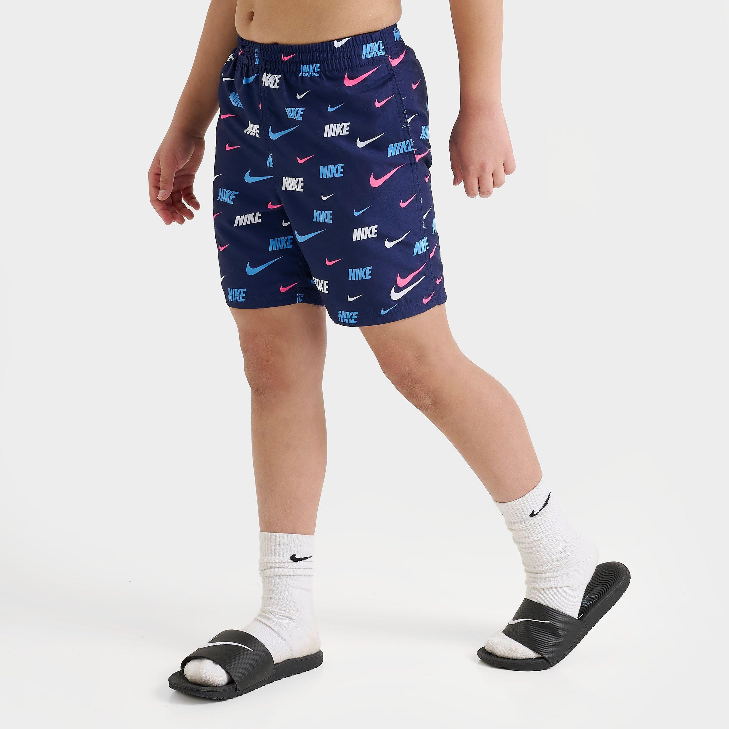 Nike Kids Swoosh Allover Print Swim Shorts in Navy/Pink/University Blue Size: Small